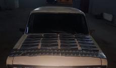 Spirtli içkiləri və siqaretləri avtomobildə gizlətdi