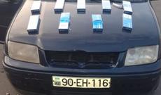 Avtomobildə gizlədilmiş spirtli içkilər və siqaretlər aşkarlanıb